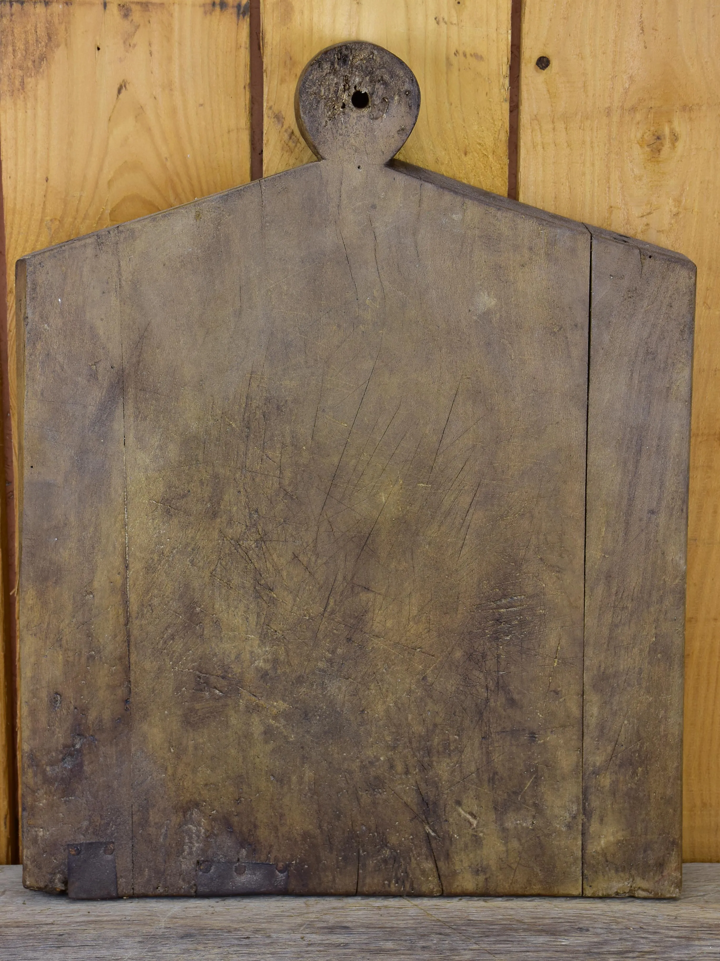 Antique French cutting board in the shape of a coat hanger